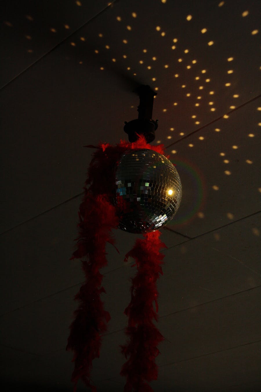 Disco ball with red feather boa